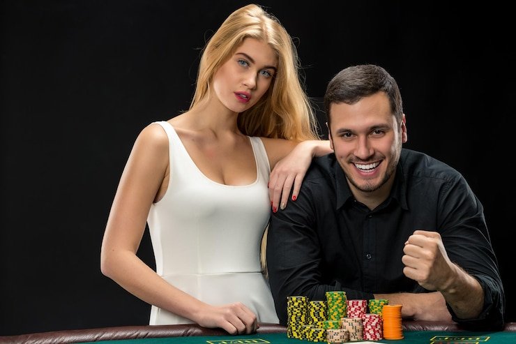 Live dealer conducting Texas Hold'em Bonus with multiple players